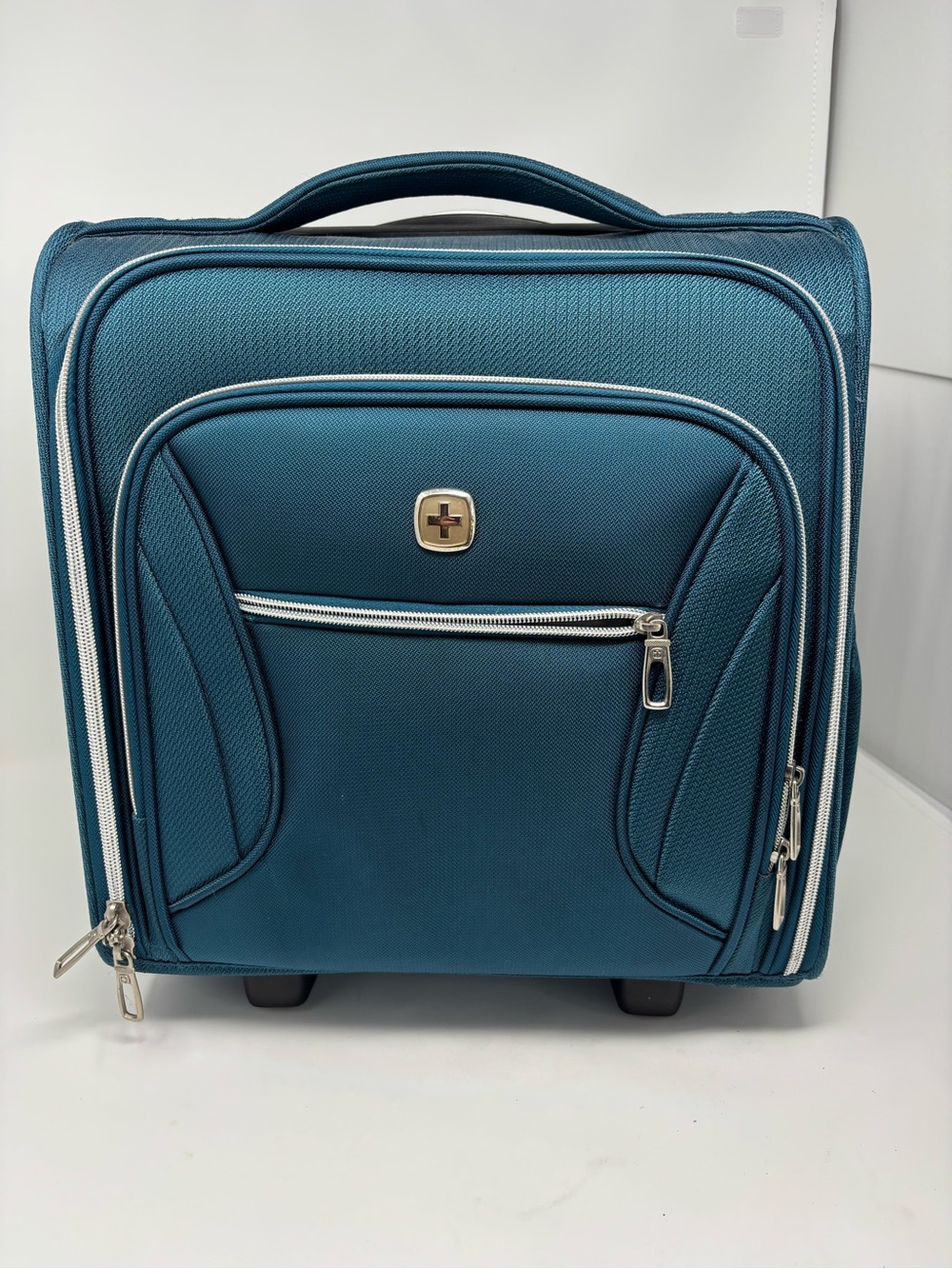 SwissGear Teal Travel Carry-On Bag with handles and rolls